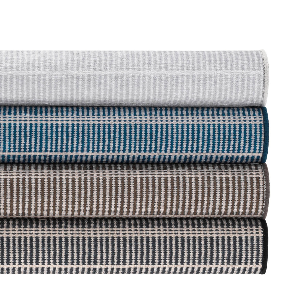 Dash & Albert Samson Machine Washable Rug in Grey, Navy, Oak and Black, rolled stack