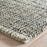 Dash & Albert Marled Handwoven Cotton Rug in Black, corner detail