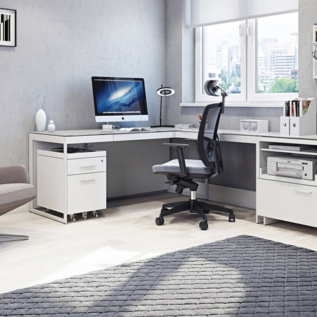 BDi Centro 6401 Desk in Satin White on Oak with Grey Glass, with a return on a multi-function cabinet, in a home office