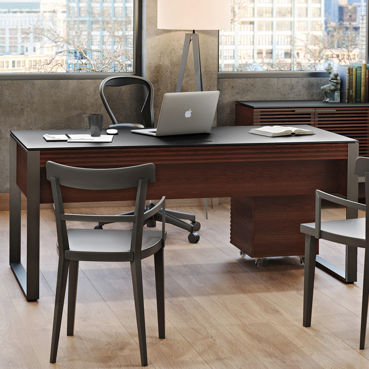 BDi Corridor 6521 Executive Office Desk in Chocolate Stained Walnut, seen from the guest side with two chairs, a credenza behind