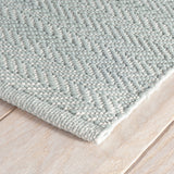 Dash & Albert Herringbone Handwoven Indoor/Outdoor Rug in Light Blue / Ivory, corner detail