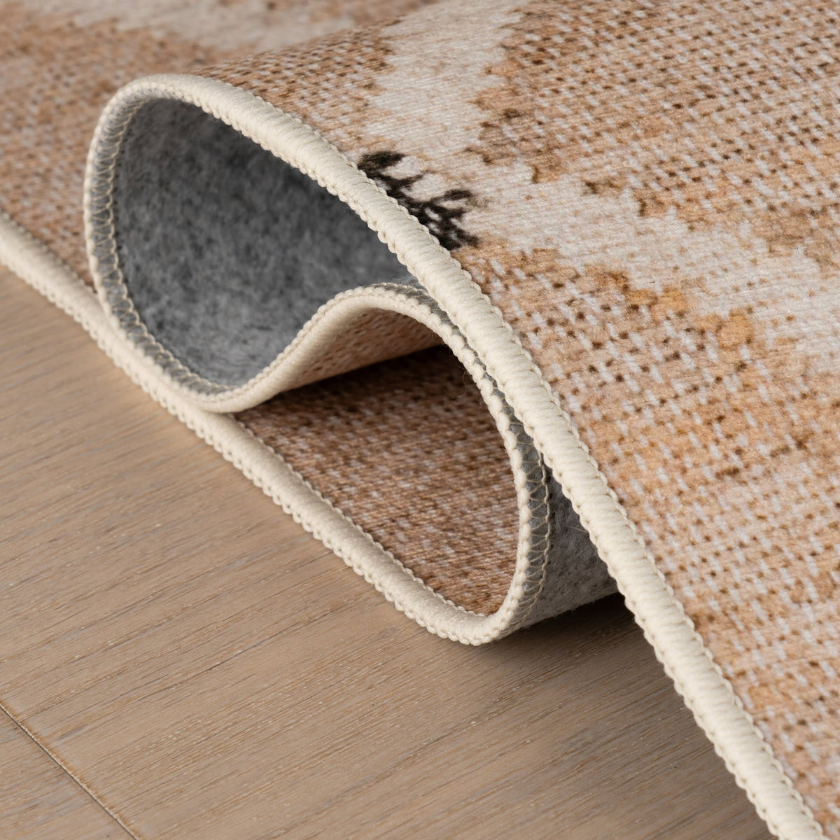 Dash & Albert Kali Machine Washable Rug in Natural, folded