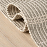 Dash & Albert Marlo Handwoven Indoor/Outdoor Rug in Platinum, folded