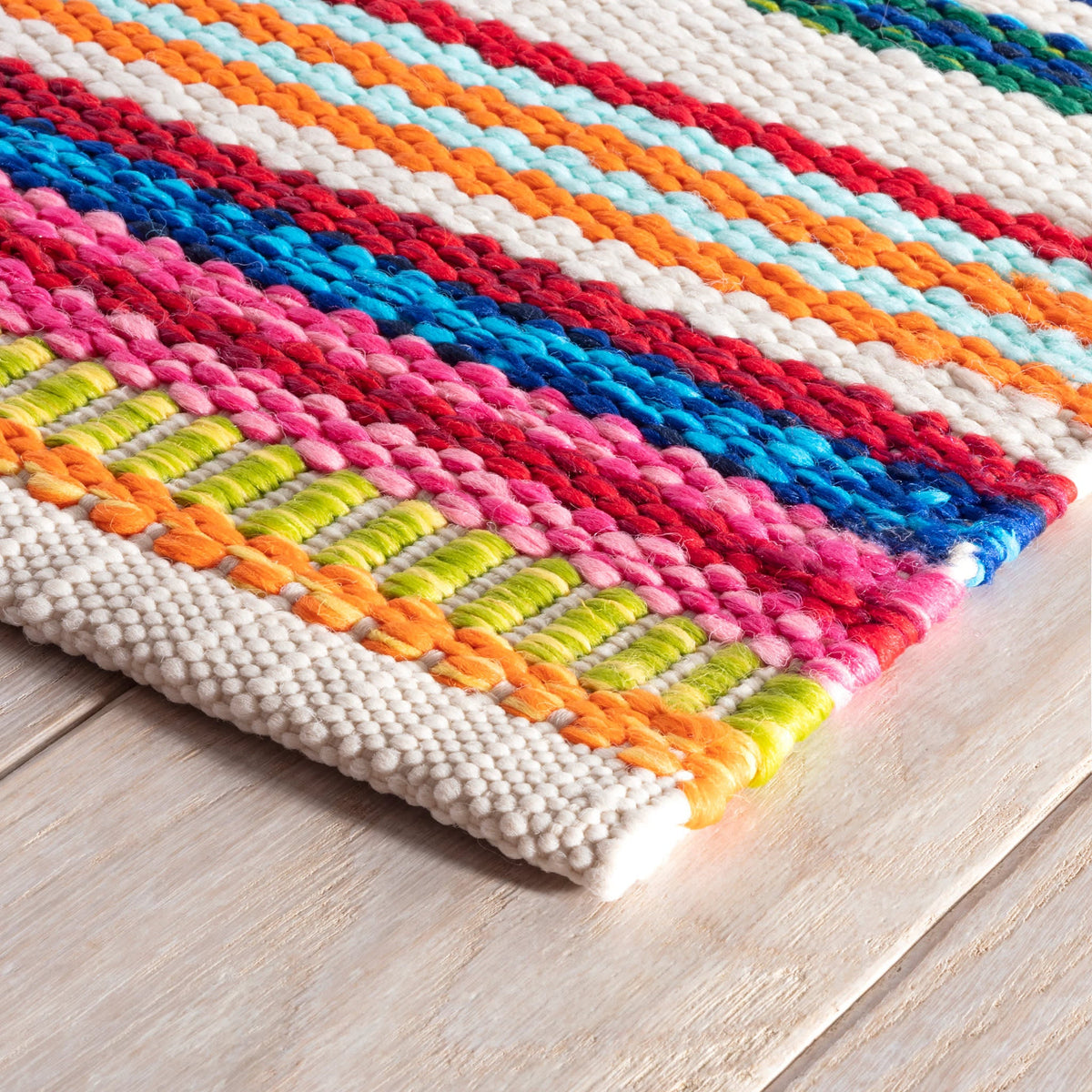 Dash & Albert Bright Stripe Handwoven Indoor/Outdoor Rug in Multi, corner detail
