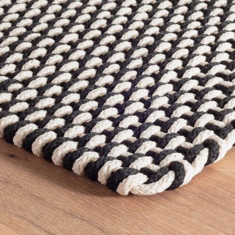 Dash & Albert Two-Tone Rope Handwoven Indoor/Outdoor Rug in Black / Ivory, corner detail