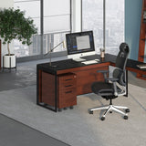 BDi Sequel 20 6101 Desk in Chocolate Stained Walnut, with a black frame, return and mobile file, in an office