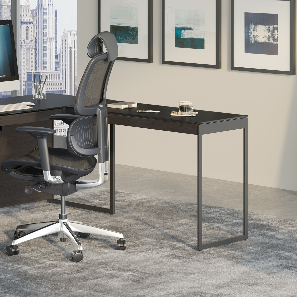 BDi Sequel 20 6112 Desk Extension in Charcoal Stained Ash, with a black frame, joined to the desk with a mobile file, in an office