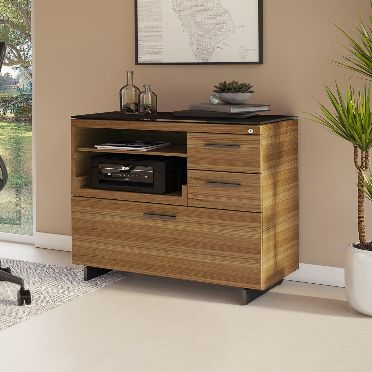 BDi Sequel 20 6117 Multi Function Cabinet in Natural Walnut, with a black base, beside a desk, in a home office