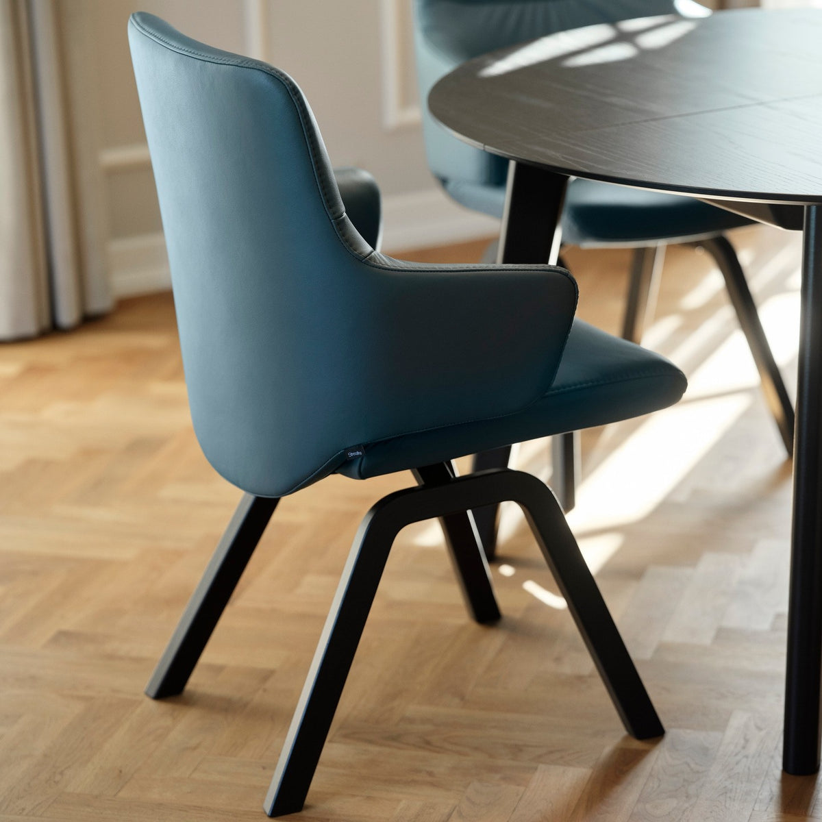 Stressless Mint Low Back Dining Chair with Vertical Legs (D100), room setting, shown in Paloma Teal Blue, D200 all-groups