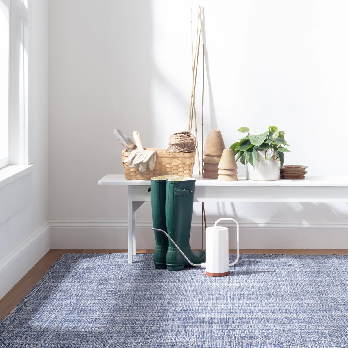 Dash & Albert Fusion Handwoven Indoor/Outdoor Rug in Blue, entry setting
