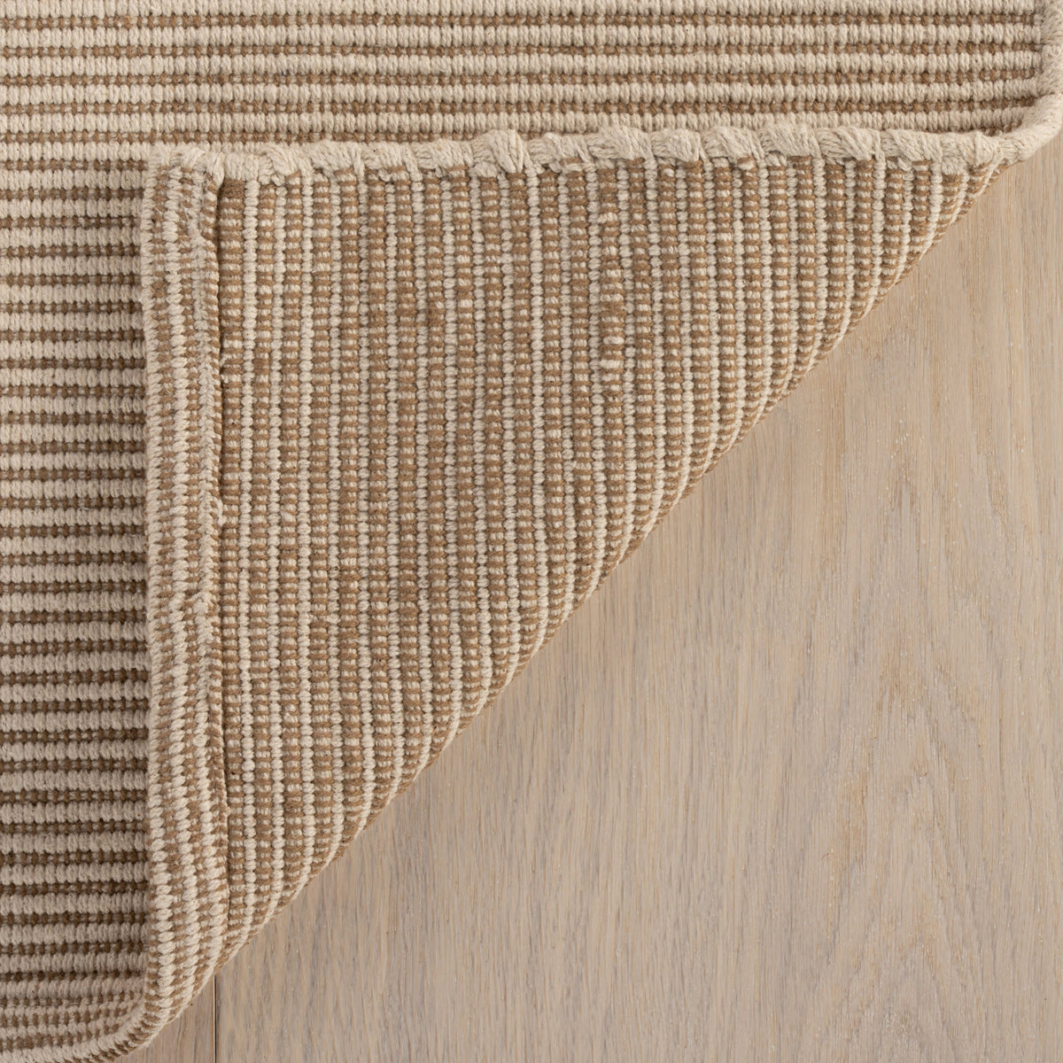Dash & Albert Haverhill Handwoven Cotton Rug in Natural, corner turned back