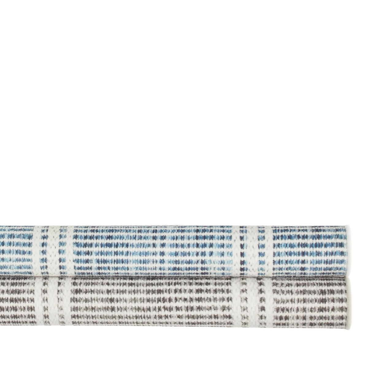 Dash & Albert Malta Machine Washable Rug in Blue and Grey, rolled stack