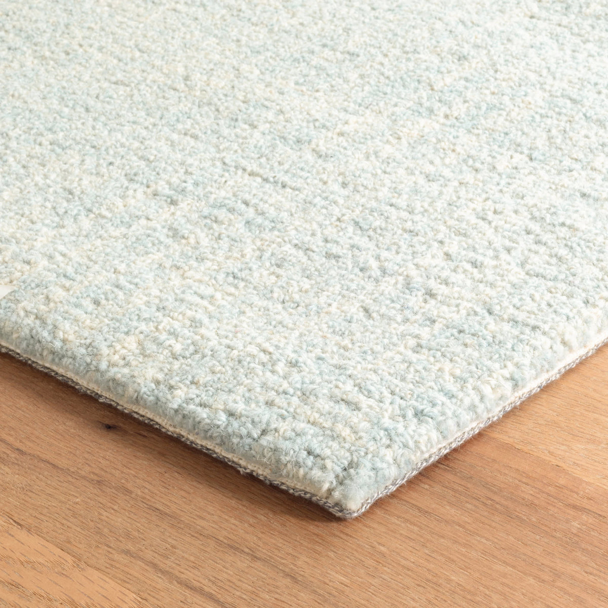 Dash & Albert Crosshatch Hand Micro Hooked Wool Rug in Sky, corner detail