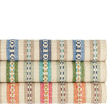 Dash & Albert Long Slade Handwoven Cotton Rug in Indigo, Teal and Spice, rolled stack