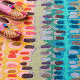 Dash & Albert Paint Chip Hand Micro Hooked Wool Rug in Multicolour, close-up with slippers
