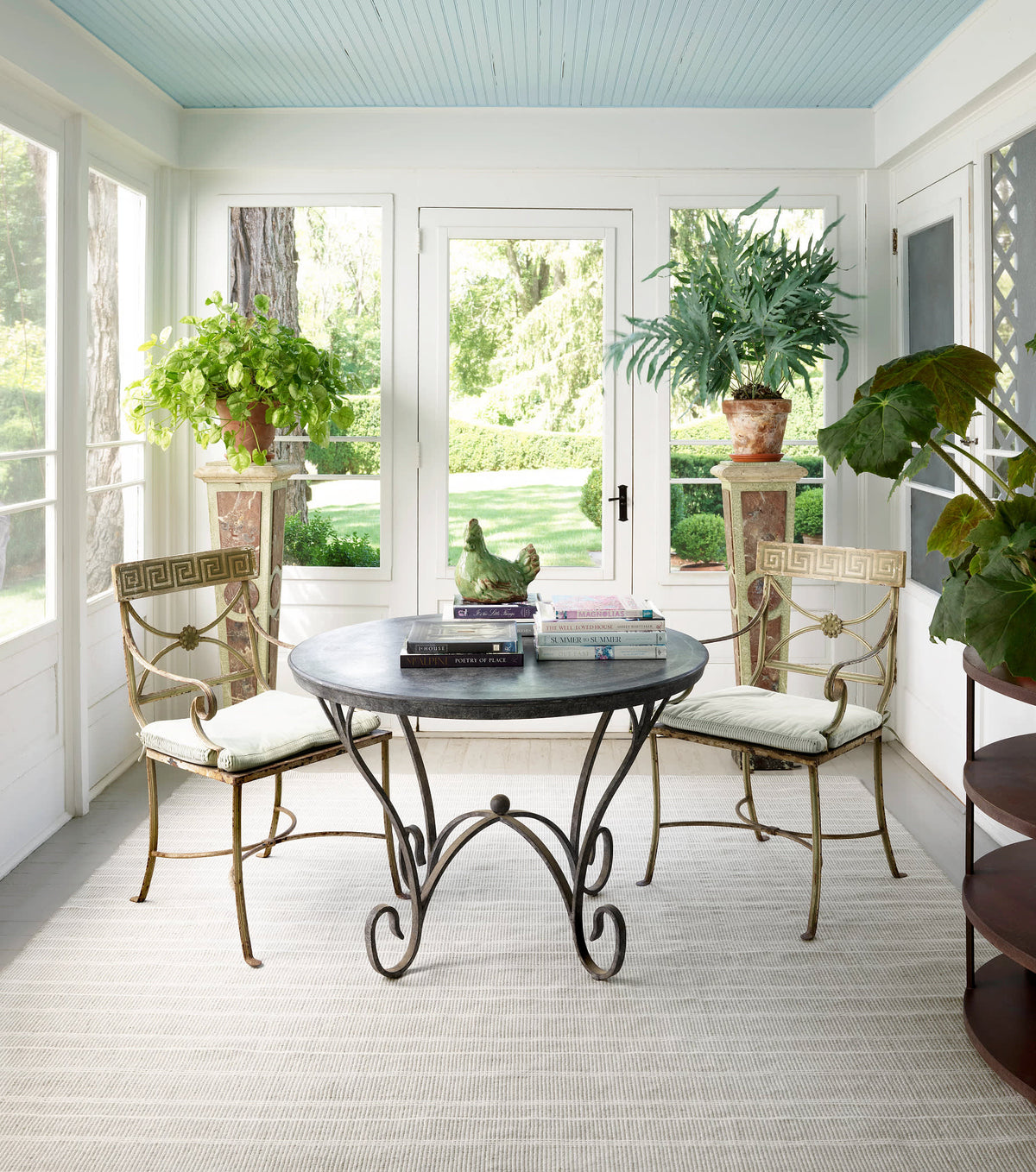 Dash & Albert Samson Handwoven Indoor/Outdoor Rug in Grey, sunroom setting