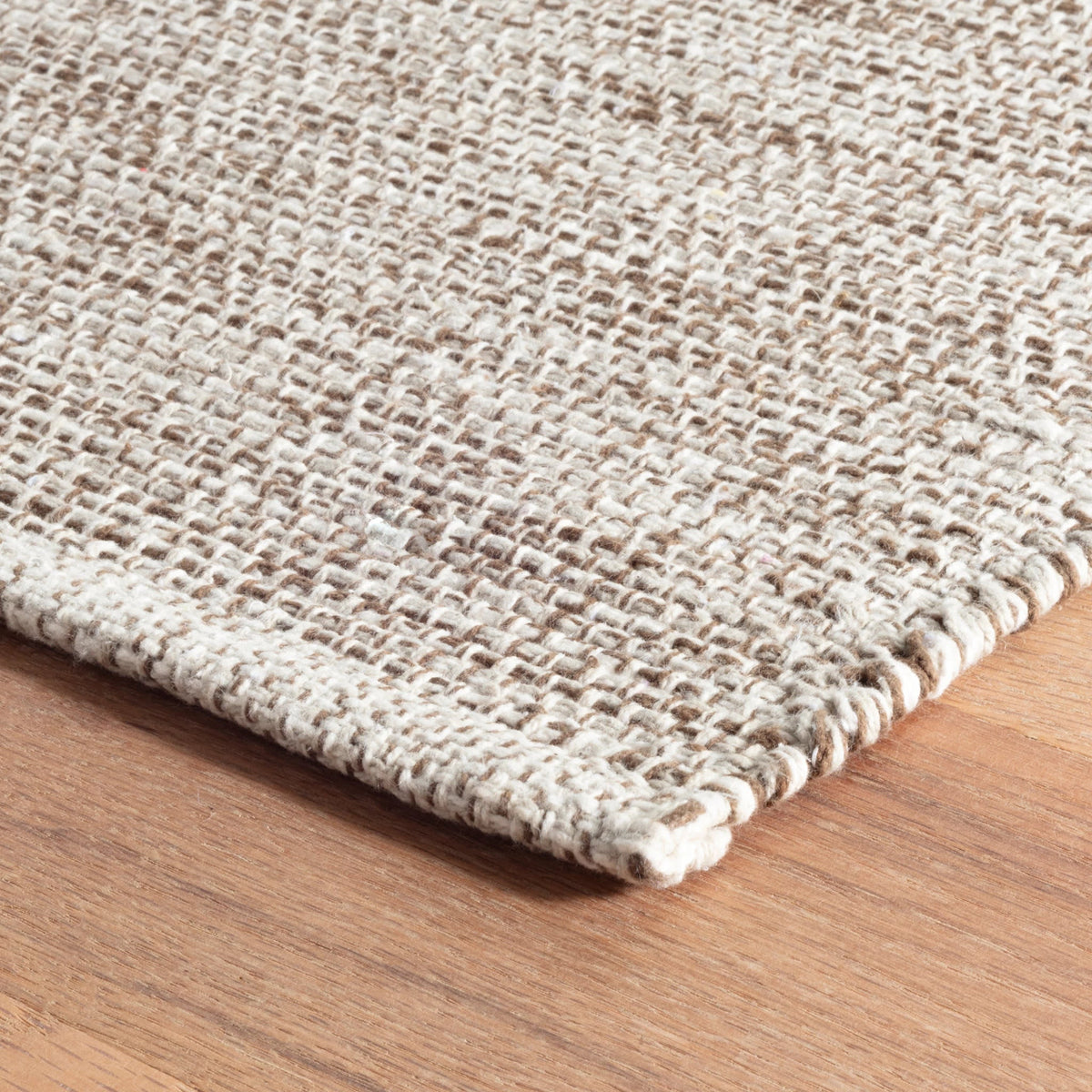 Dash & Albert Marled Handwoven Cotton Rug in Brown, corner detail