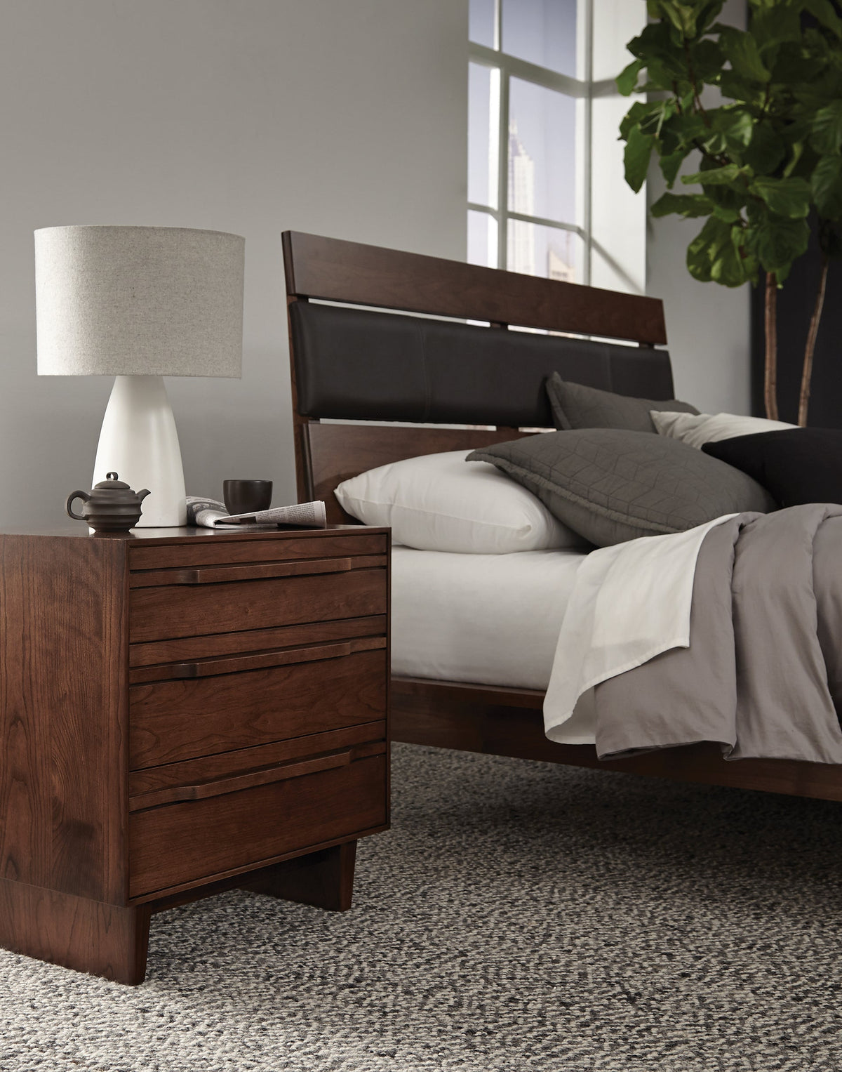 West Bros Camber Bedside Chest, in a room setting