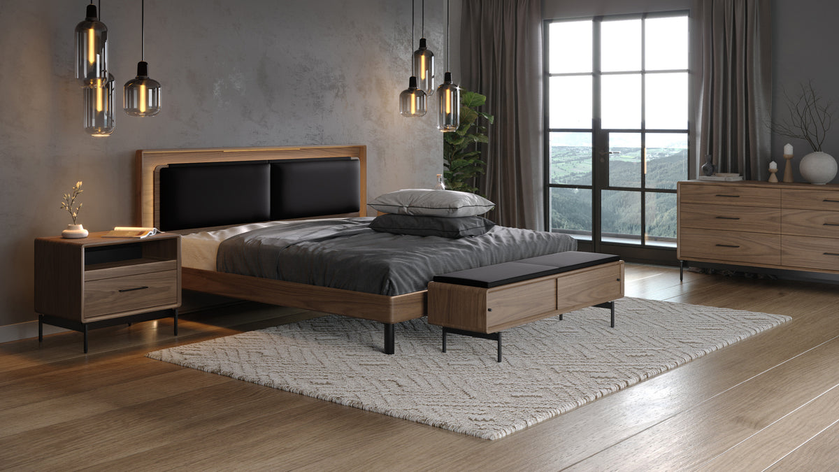 BDi Linq Bench in Pepper | Leather, with a Natural Walnut frame, at the foot of a bed with Contour cushions