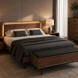 BDi Linq Up-Linq Bed in Natural Walnut, queen, in a bedroom at night with a bench and chest