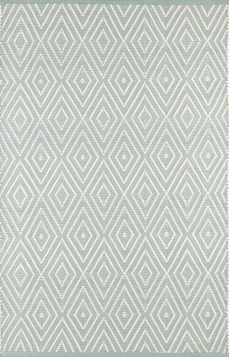 Rug with diamond pattern on a plain background