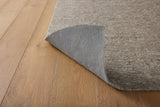 Loloi Loloi- Grip 3/8" Rug Pad in Beige, corner turned over, showing the underside