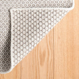 Dash & Albert Honeycomb Handwoven Wool Rug in Ivory / Grey, corner turned back