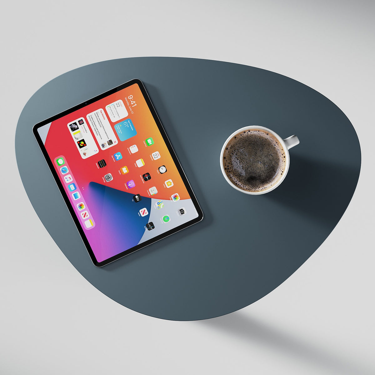 BDi Bink Laptop Stand / Side Table in Ocean, top view with a tablet and a coffee cup