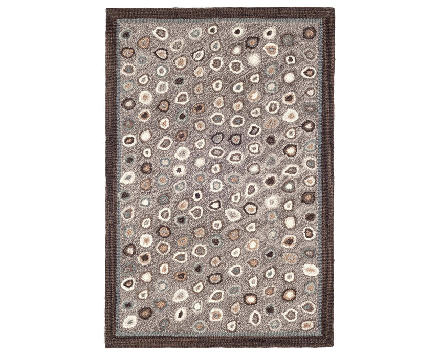 Rug with a Cat's Paw Hand Micro Hooked pattern on a plain background