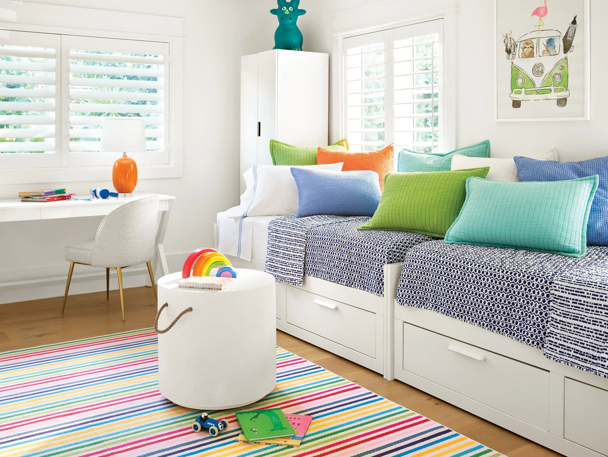 Dash & Albert Rainbow Stripe Machine Washable Rug in Multi, playroom setting