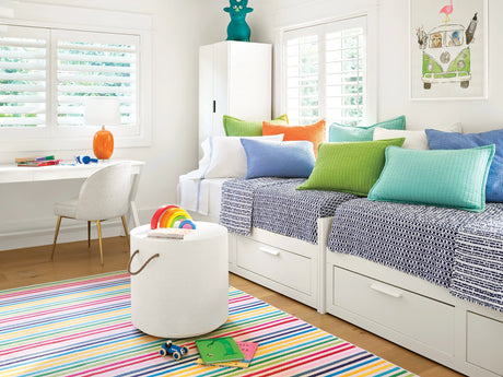 Dash & Albert Rainbow Stripe Machine Washable Rug in Multi, playroom setting