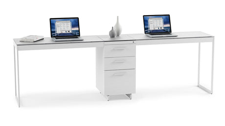 BDi Centro 6414 3 Drawer File Cabinet in Satin White on Oak with Grey Glass, between two desk tops, on white