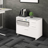BDi Centro 6417 Multi Function Cabinet in Satin White on Oak with Grey Glass, beside a standing desk, in an office