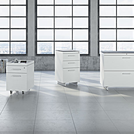 BDi Centro 6414 3 Drawer File Cabinet in Satin White on Oak with Grey Glass, with other Centro storage pieces, in a loft