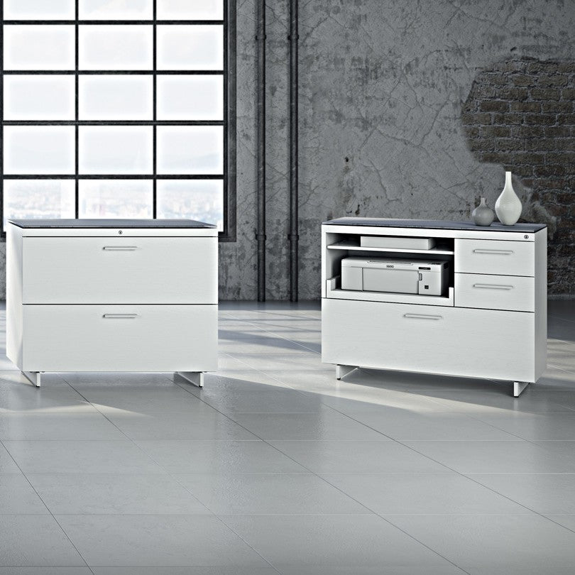 BDi Centro 6417 Multi Function Cabinet in Satin White on Oak with Grey Glass, with other Centro storage pieces, in a loft