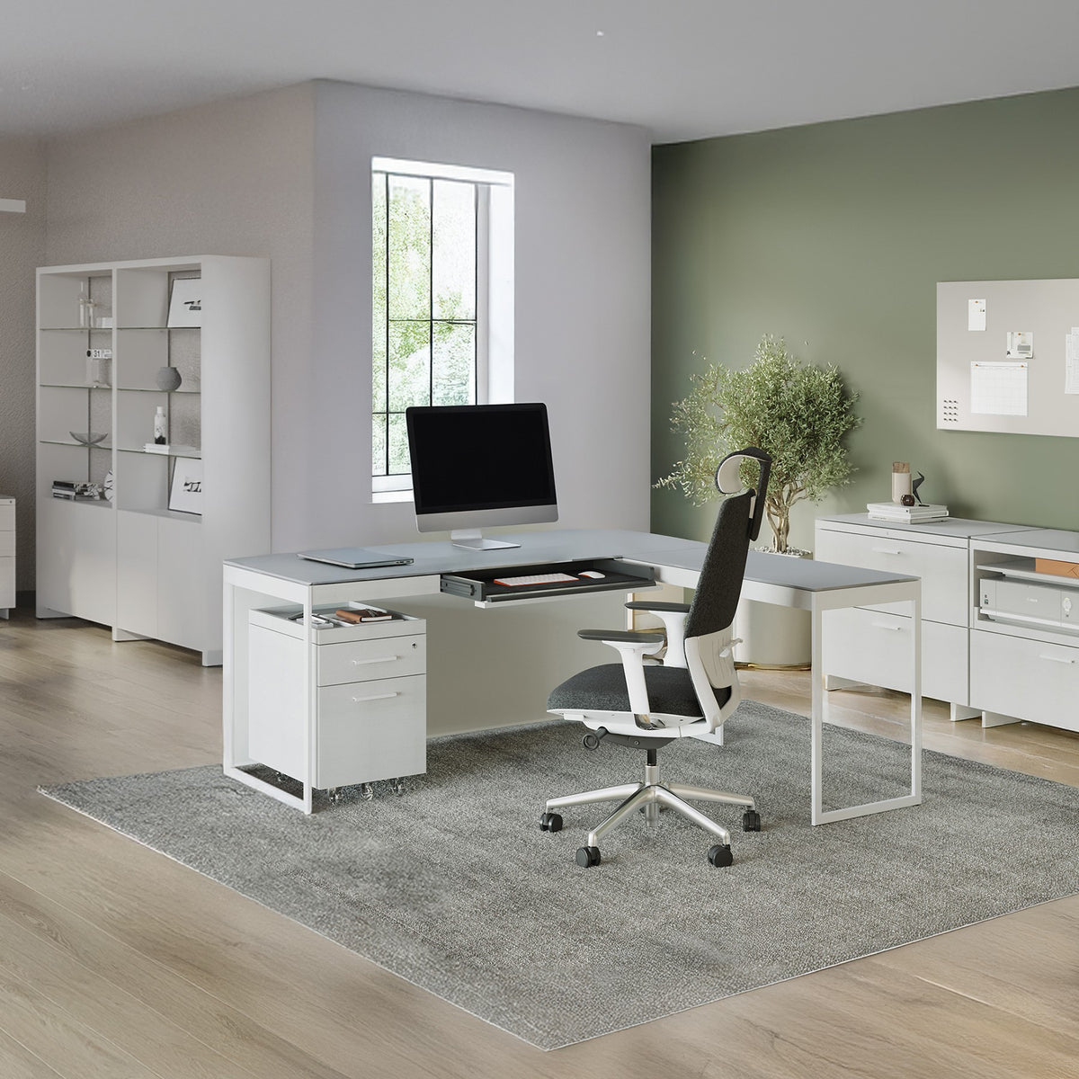 BDi Centro 6401 Desk in Satin White on Oak with Grey Glass, with a return and mobile file, in an open office