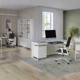 BDi Centro 6407 Mobile File Pedestal in Satin White on Oak, under a desk, in an open office