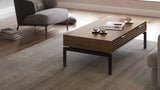 BDi Cora 1172 Coffee Table in Natural Walnut, in a living room with a lounge chair