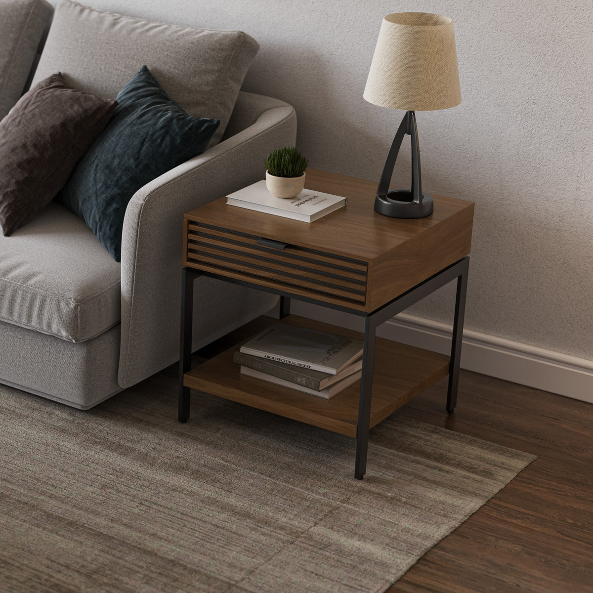 BDi Cora 1176 End Table in Natural Walnut, beside a sofa with the matching coffee table