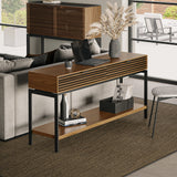 BDi Cora 1173 Console Table in Natural Walnut, behind a sofa, used as a laptop desk