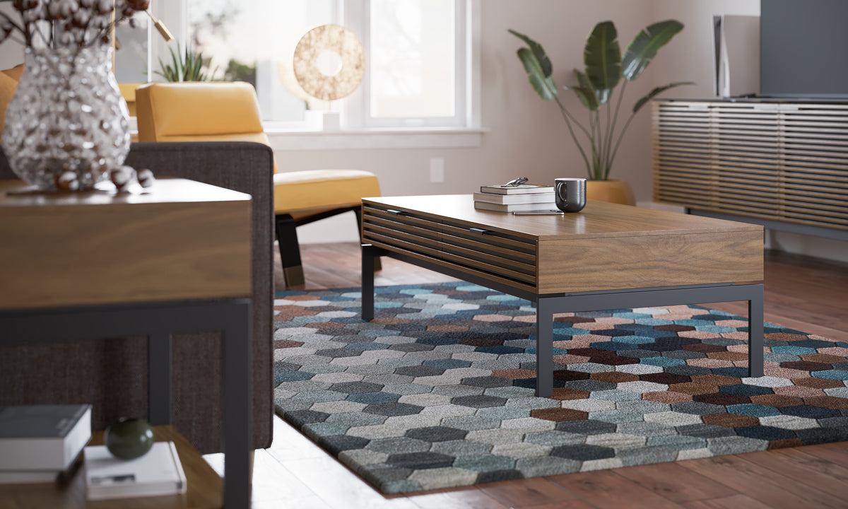 BDi Cora 1172 Coffee Table in Natural Walnut, in a living room on a patterned rug