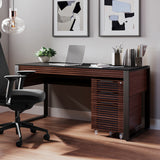 BDi Corridor 6501 Office Desk in Chocolate Stained Walnut, with a file pedestal, in a home office with pendant lights