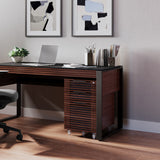 BDi Corridor 6507 Mobile File Cabinet in Chocolate Stained Walnut, under a desk in a home office