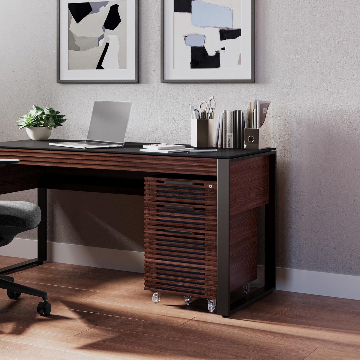 BDi Corridor 6507 Mobile File Cabinet in Chocolate Stained Walnut, under a desk in a home office