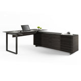 BDi Corridor 6531 L-Shaped Office Desk in Charcoal Stained Ash, angled view with a laptop, on white