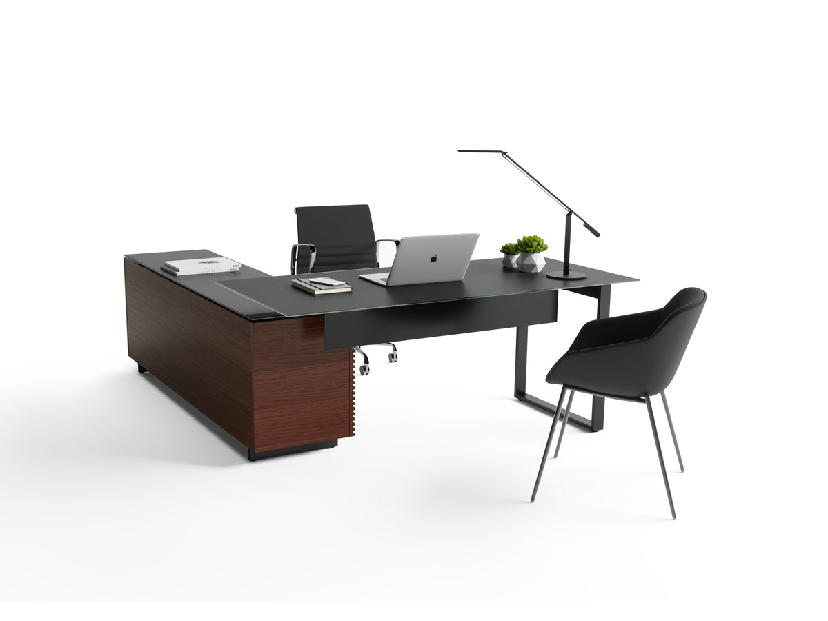 BDi Corridor 6531 L-Shaped Office Desk in Chocolate Stained Walnut, back view with a desk chair and guest chair, on white