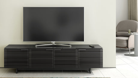BDi Corridor 8173 Low Profile Media Console in Charcoal Stained Ash, in a living room with a TV