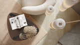 BDi Dino 1367 End Table in Natural Walnut, top view beside a lounge chair