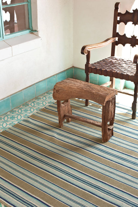 Dash & Albert Heron Stripe Handwoven Cotton Rug in Blue, room setting