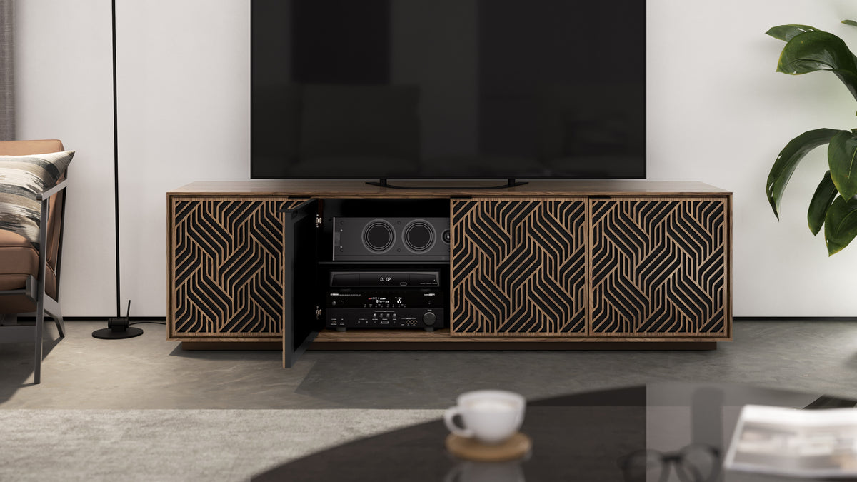 BDi Elements 8703 Media + Storage Cabinet in Natural Walnut, one door open with media equipment, in a living room, with Weave door fronts